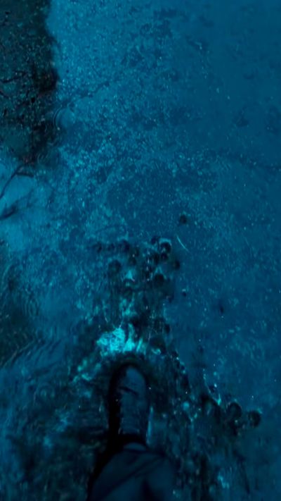 man stepping in puddle, calm rain atmosphere, blue night, blue air