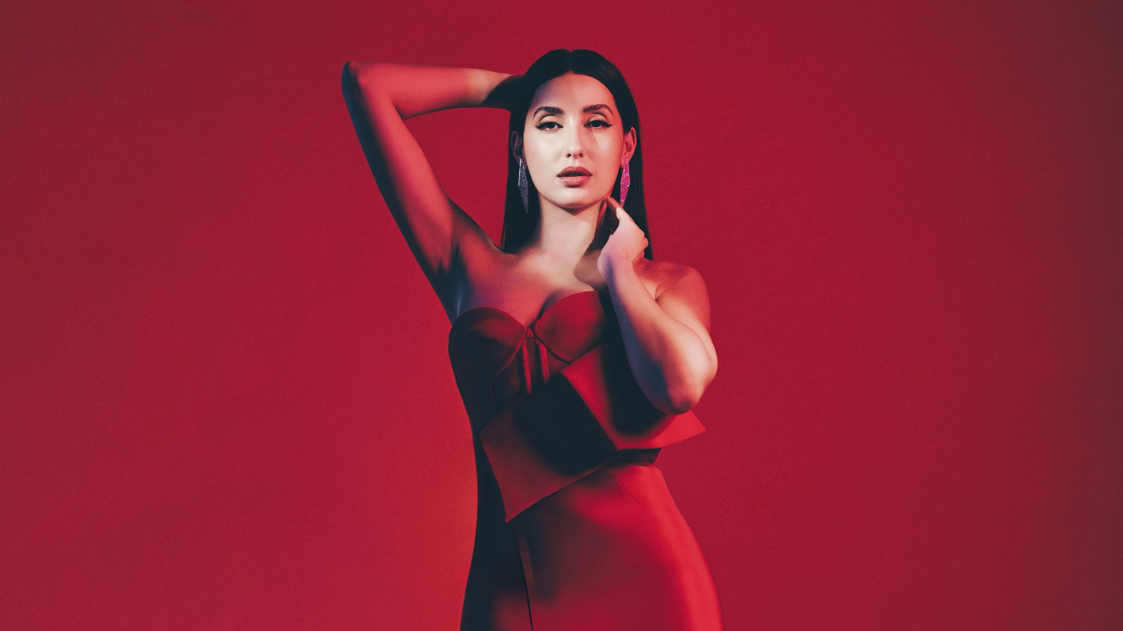 Nora Fatehi Red background ultra HD 4K wallpaper