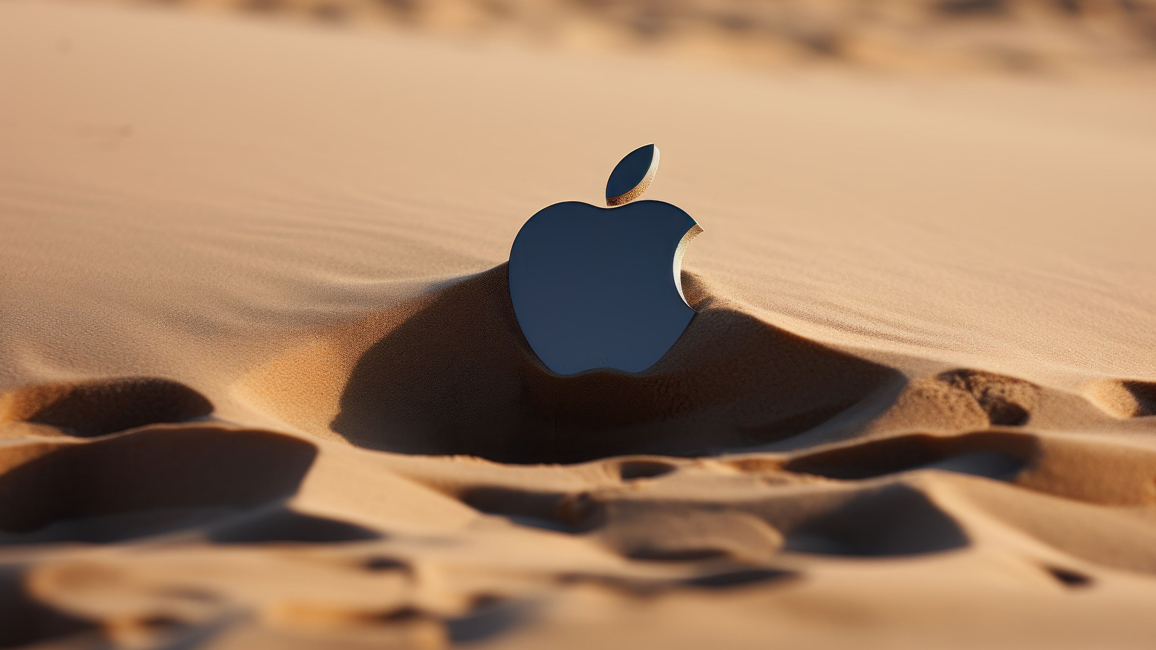 Apple Logo in Sand 4K Wallpaper