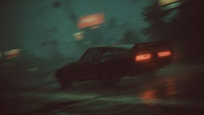 Classic car glowing taillights wet night motion