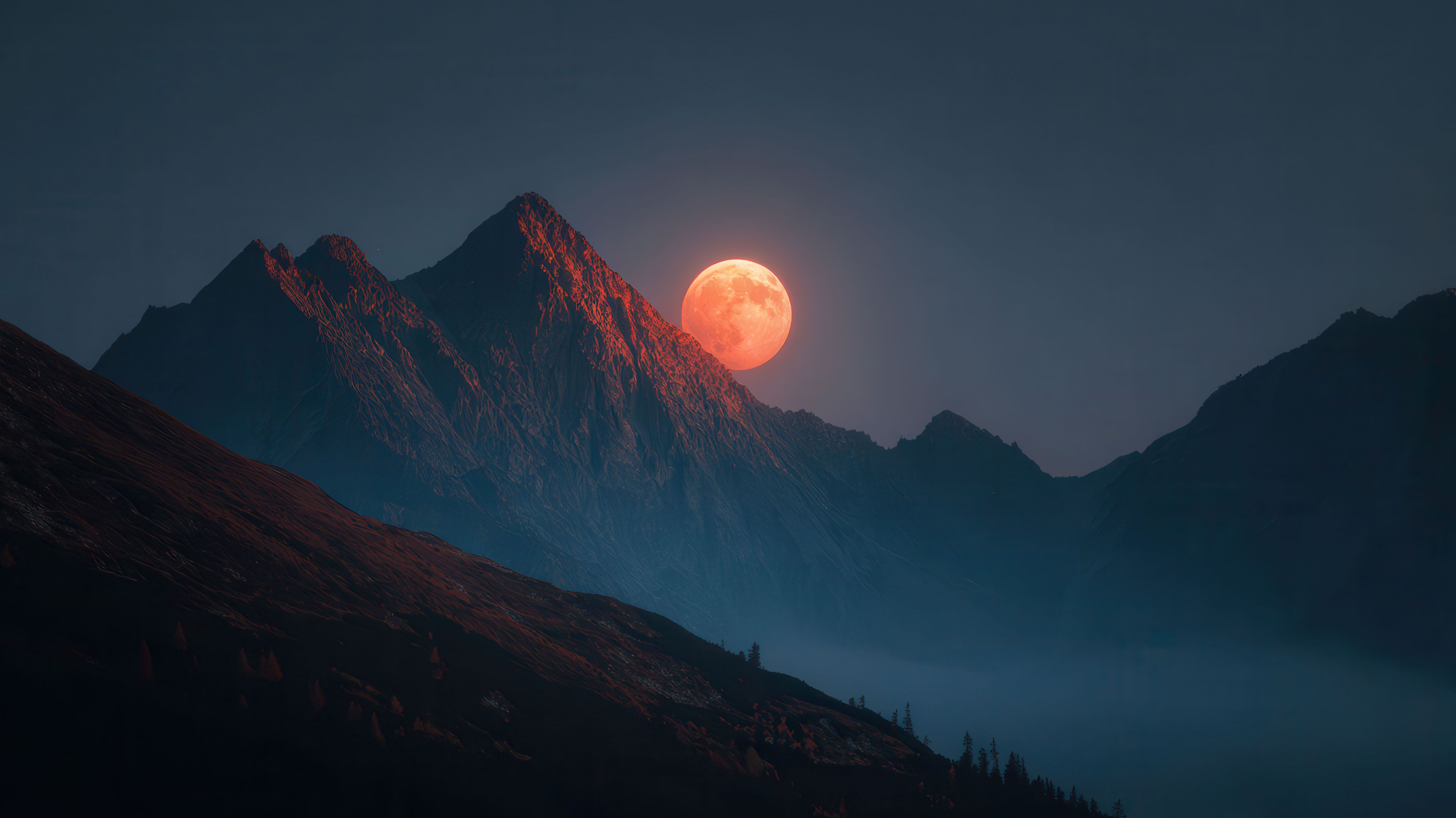 Giant Crimson Moon Above Dark Mountain Peaks