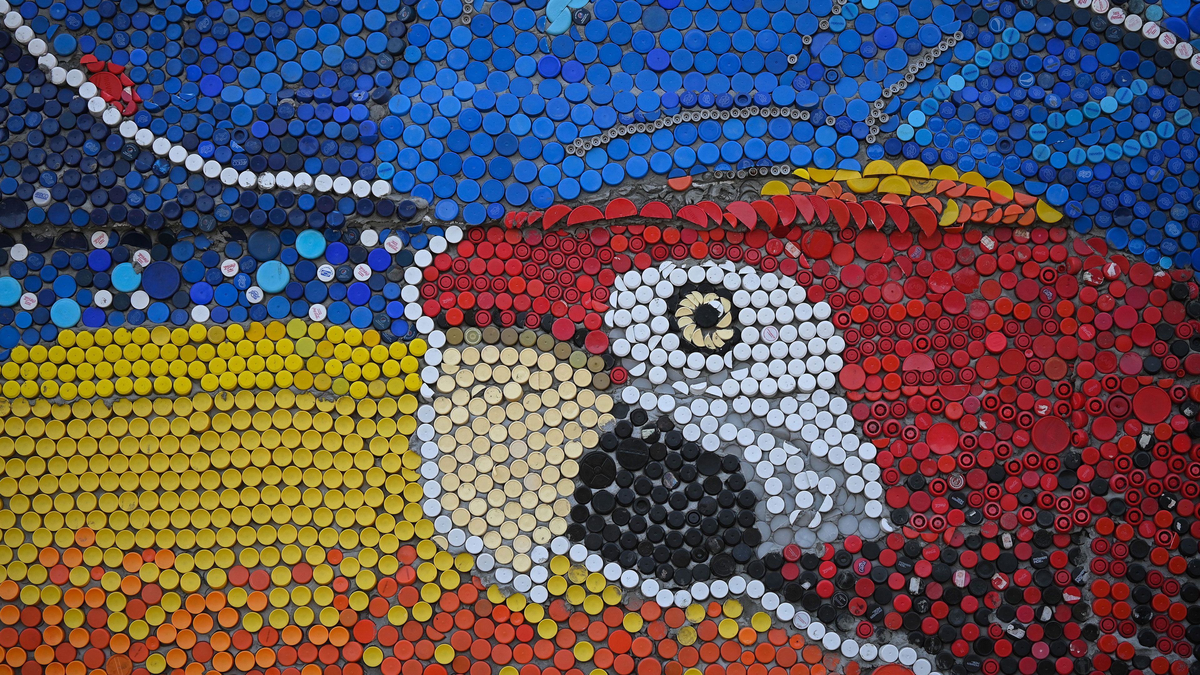 Oscar Olivares' Vibrant Guatire Bottle Cap Parrot Wallpaper