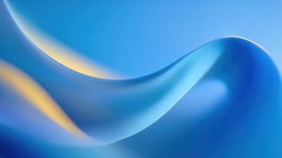 A serene abstract image featuring smooth, fluid waves in multiple shades of blue, with hints of soft yellow light, creating a tranquil and calming atmosphere.