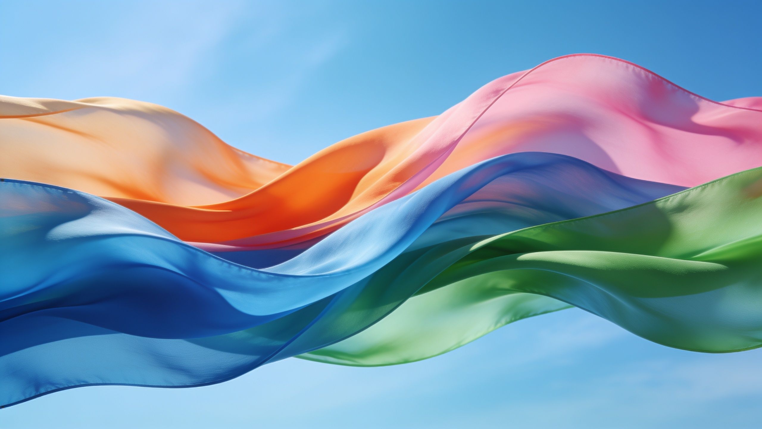 Flowing ribbons of vibrant colors, including orange, pink, blue, and green, gracefully wave against a clear blue sky, creating a dynamic and uplifting mood.