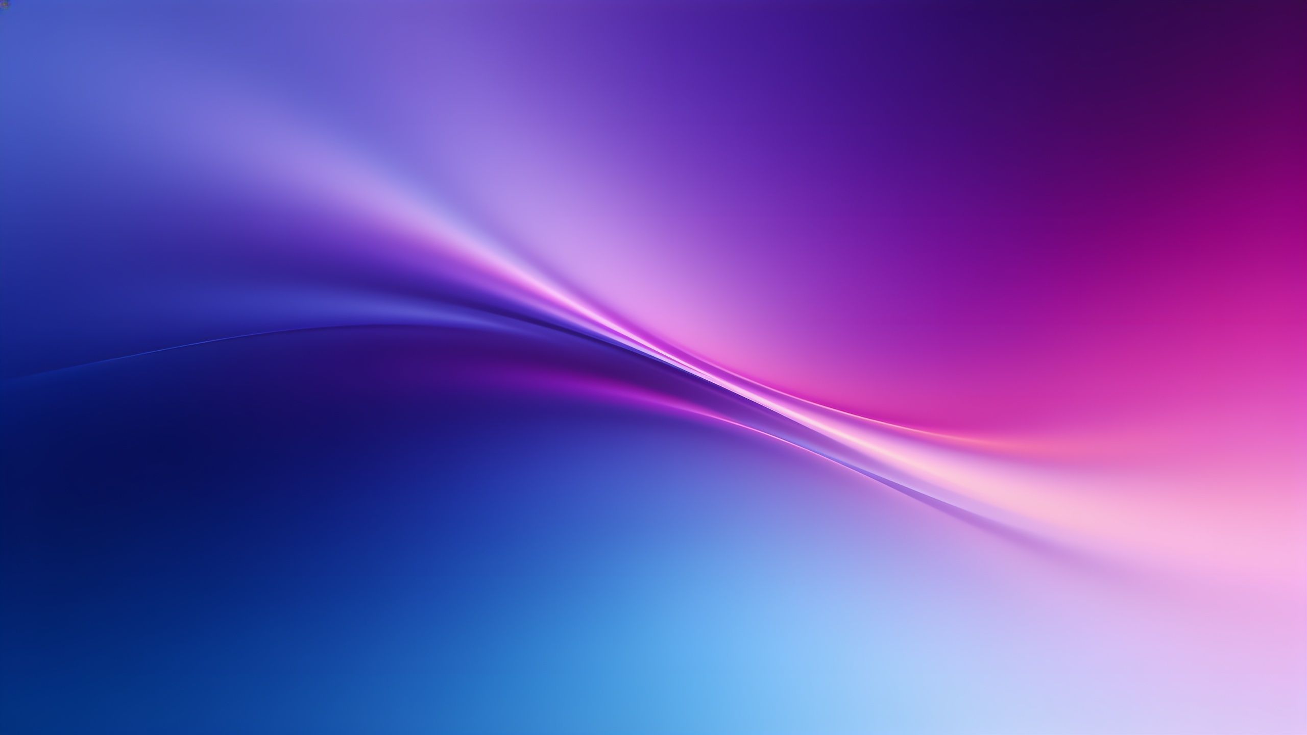 A dynamic wallpaper featuring smooth, flowing waves of vibrant gradient colors blending from deep blue to bright pink and purple, creating a sense of motion and energy.