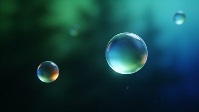 Colorful bubbles float gently against a blurred, abstract background of deep green and blue hues, creating a serene and dreamy atmosphere.
