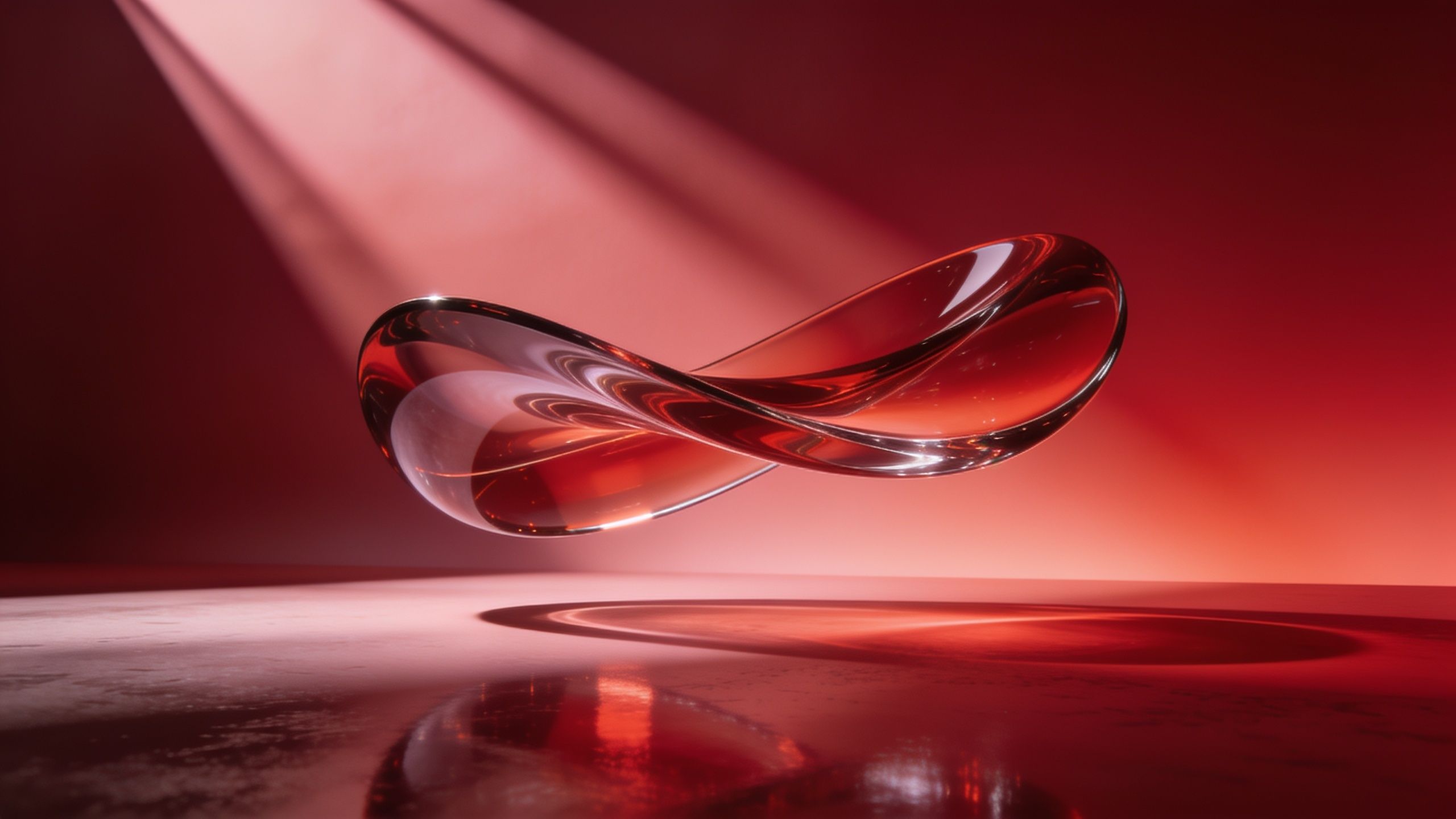 A sleek, transparent red glass infinity loop floats elegantly against a softly lit red background, creating a modern and sophisticated ambiance. The smooth reflections and soft shadows enhance the minimalist and serene mood of the design.