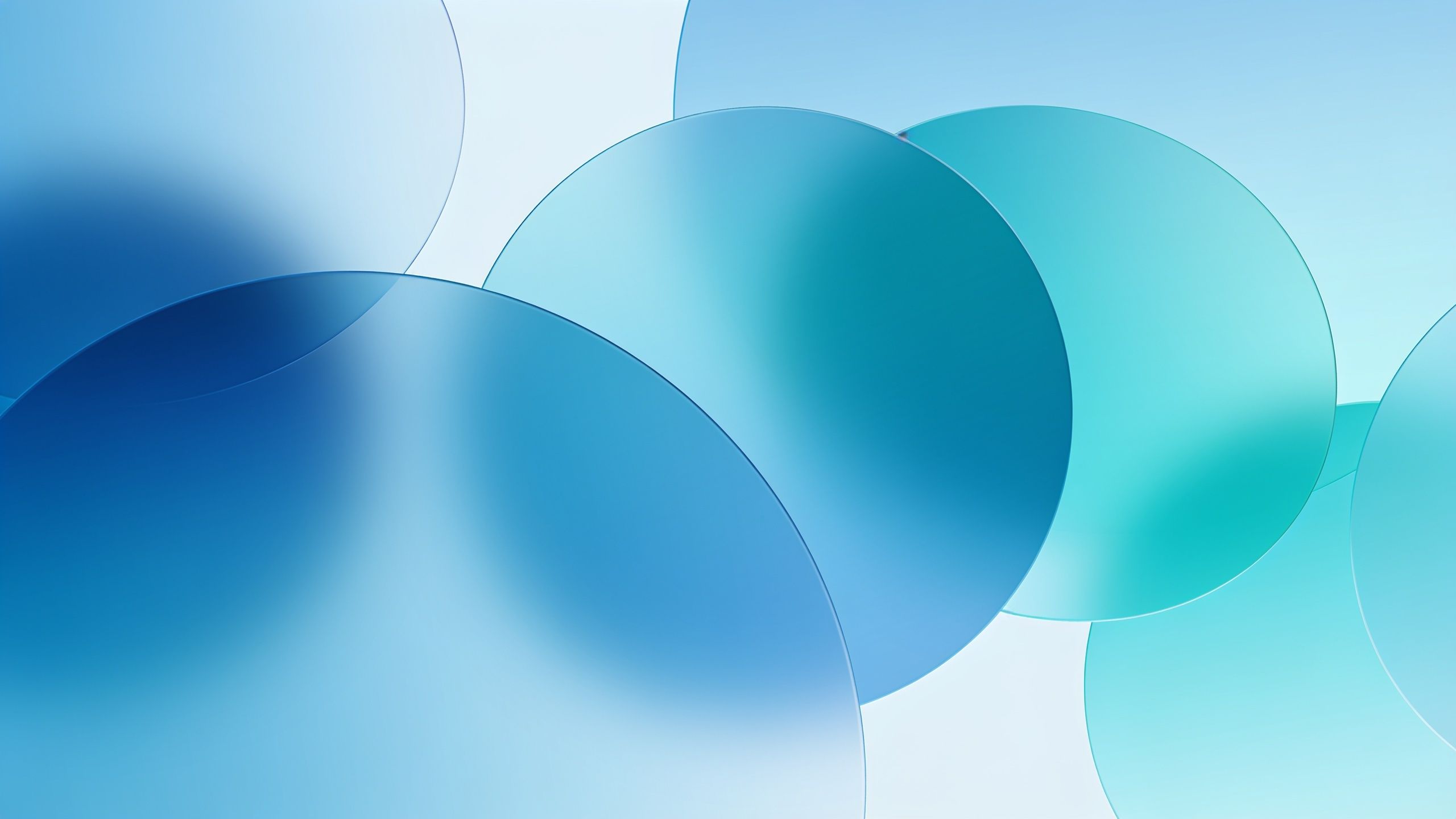A soothing abstract wallpaper featuring overlapping translucent circles in various shades of blue and teal, creating a calm and tranquil atmosphere. The soft gradients and smooth edges evoke a sense of serenity and balance.