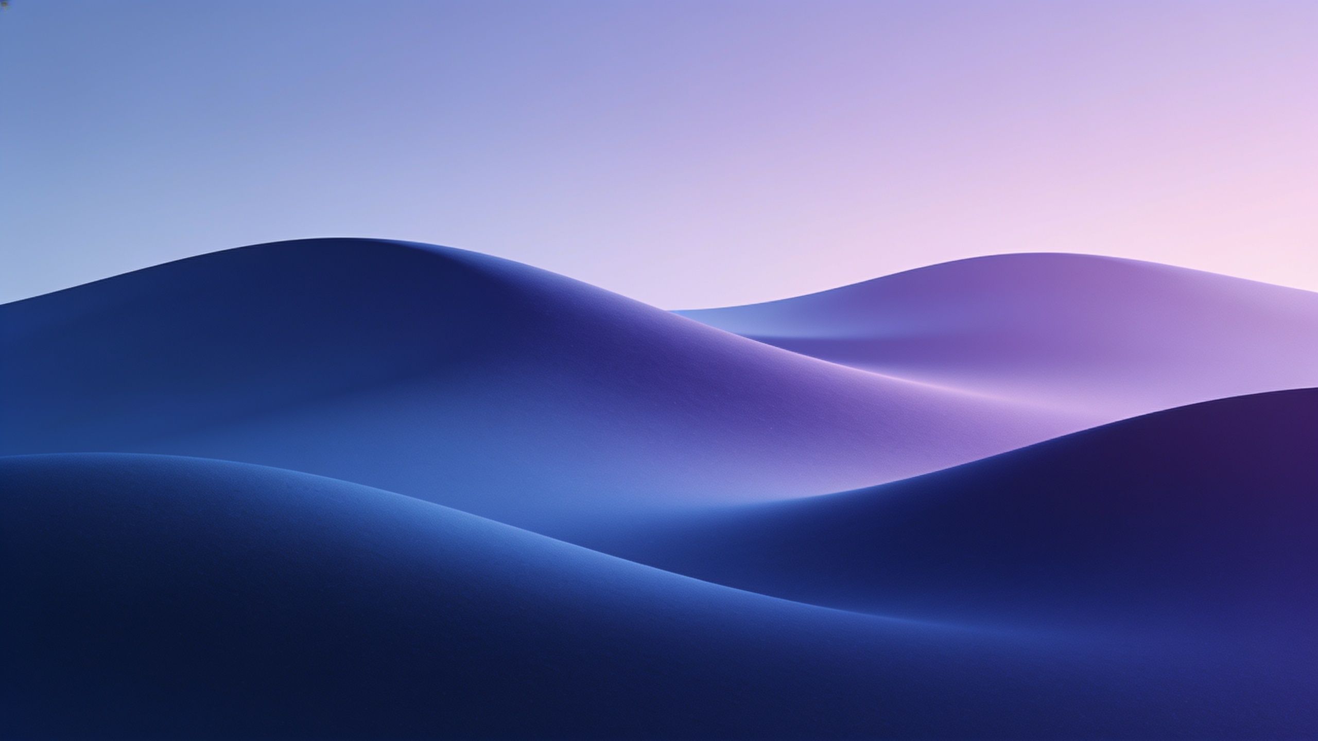 A tranquil scene of smooth, undulating blue sand dunes under a soft, pastel sky at dusk, creating a calm and serene atmosphere.