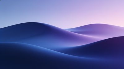 A tranquil scene of smooth, undulating blue sand dunes under a soft, pastel sky at dusk, creating a calm and serene atmosphere.