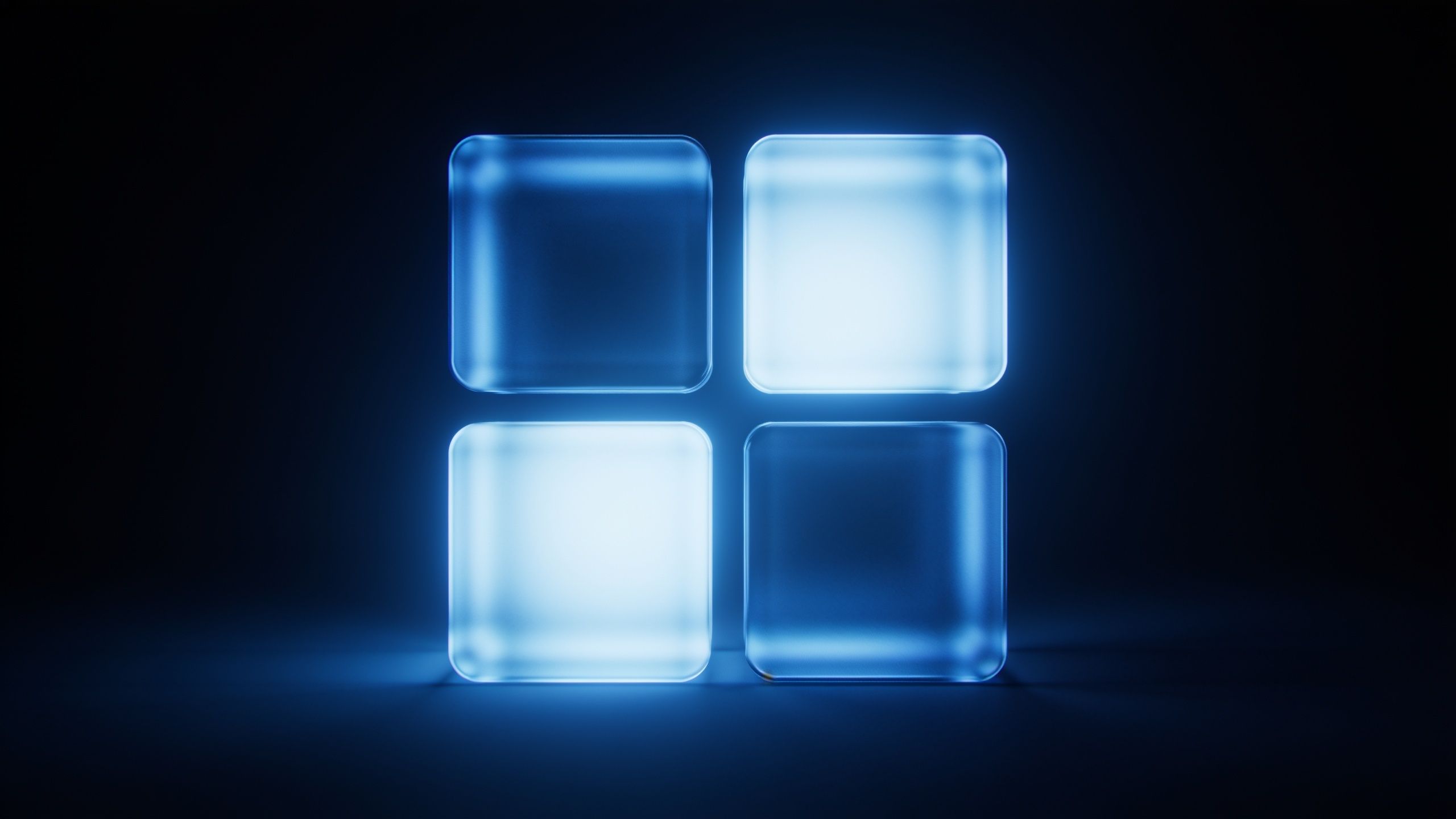Four glowing blue cubes are arranged in a square pattern against a dark background, creating a futuristic and serene ambiance.