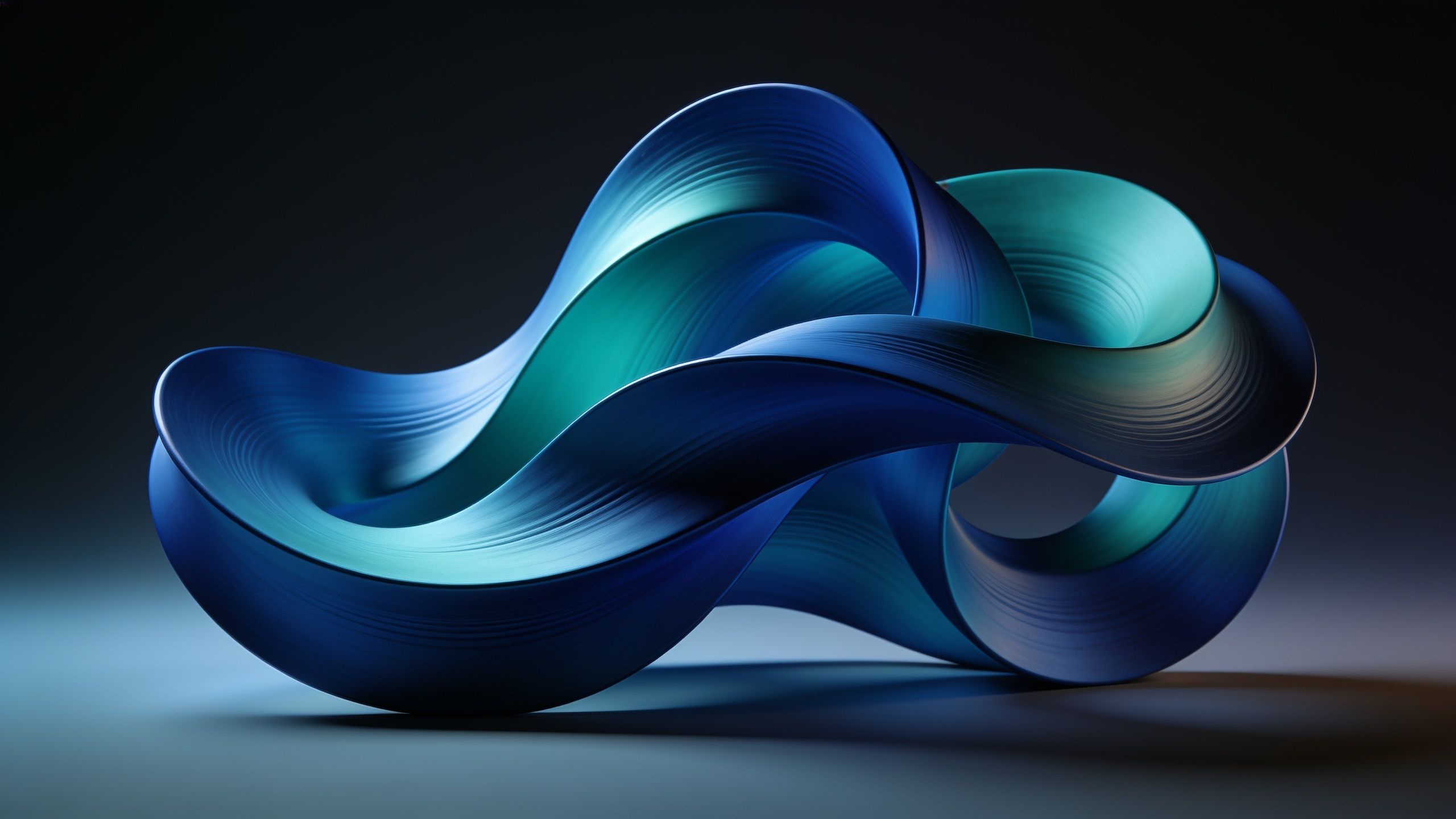 The wallpaper features elegant, flowing abstract waves in shades of blue and teal, creating a serene and calming atmosphere against a dark background. The smooth, intertwined curves convey a sense of fluidity and grace.