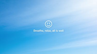 A serene blue sky serves as the backdrop for a calming message in white text that reads, "Breathe, relax, all is well," accompanied by a simple smiley face, creating a tranquil and reassuring atmosphere.