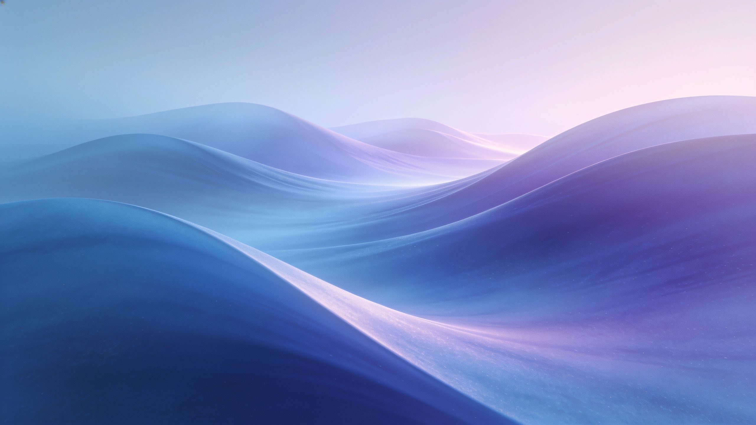 A tranquil scene of smooth, blue waves gently rolling under the soft light of dawn, creating a serene and calming atmosphere with hints of pink and purple in the sky.