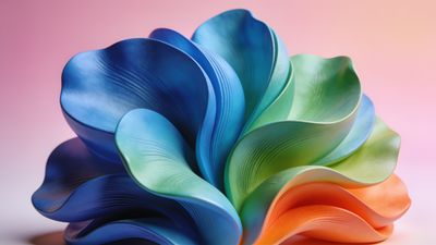 A vibrant abstract design featuring overlapping flower petals in shades of blue, green, and orange, set against a soft pink and peach gradient background, creating a lively and dynamic mood.