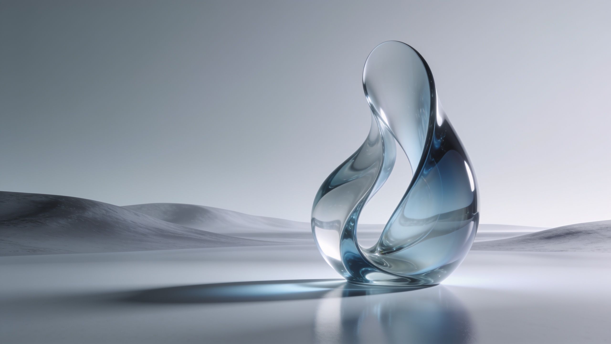 A sleek, transparent glass sculpture with fluid curves stands against a minimalist landscape of soft, undulating hills under a pale, serene sky, creating a tranquil and elegant atmosphere.