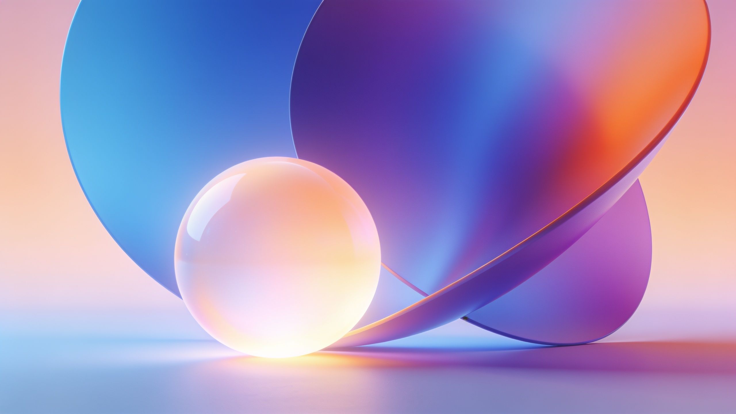A vibrant abstract wallpaper featuring glossy spheres in gradient hues of blue, purple, and orange, set against a soft, blended background, creating a serene and futuristic mood.
