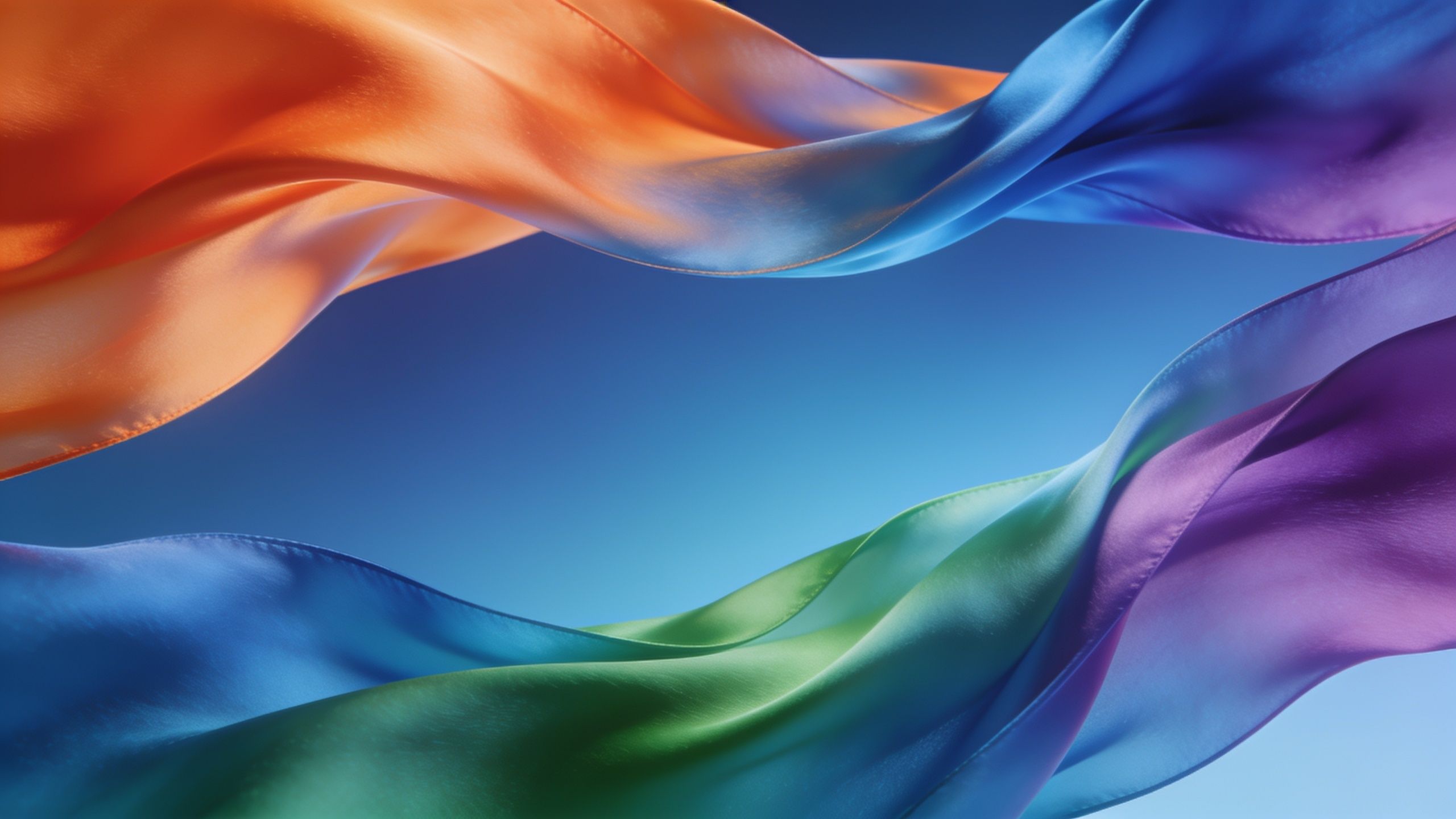 Colorful silk ribbons in shades of orange, blue, green, and purple gracefully flow against a clear blue sky, creating a vibrant and serene atmosphere.