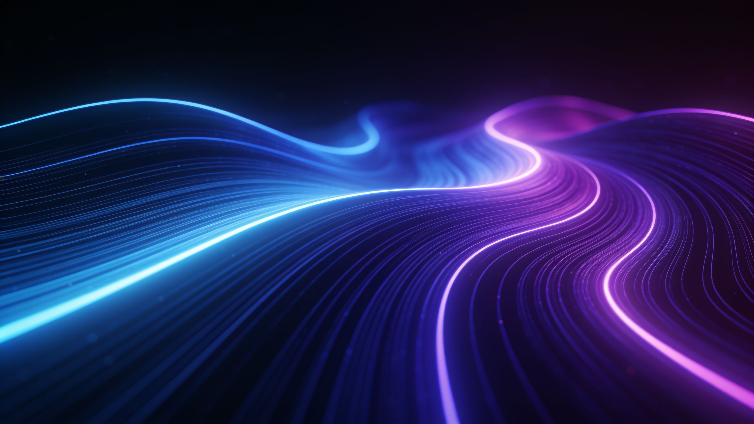 A dynamic display of vibrant neon waves in shades of blue and purple flowing across a dark background, creating an energetic and futuristic mood.