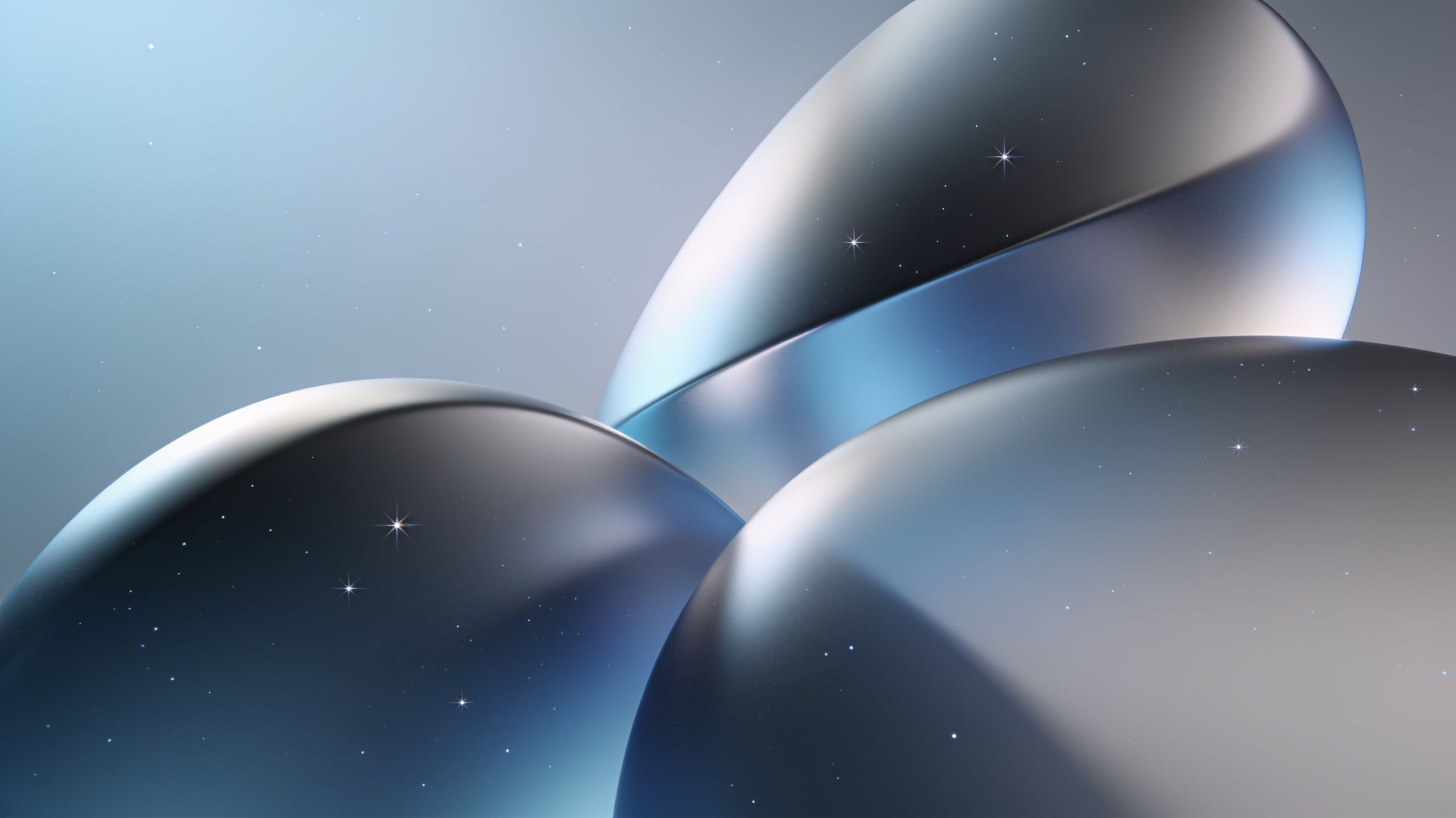 Futuristic metallic spheres with a smooth, reflective surface are set against a starry backdrop, creating a serene and otherworldly atmosphere with a soft glow. The scene evokes a sense of calm and wonder, blending elements of technology and space.