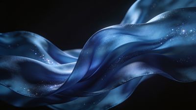 A flowing piece of ethereal blue silk drifts gracefully across a dark background, adorned with sparkling star-like specks that create a serene and dreamy atmosphere.
