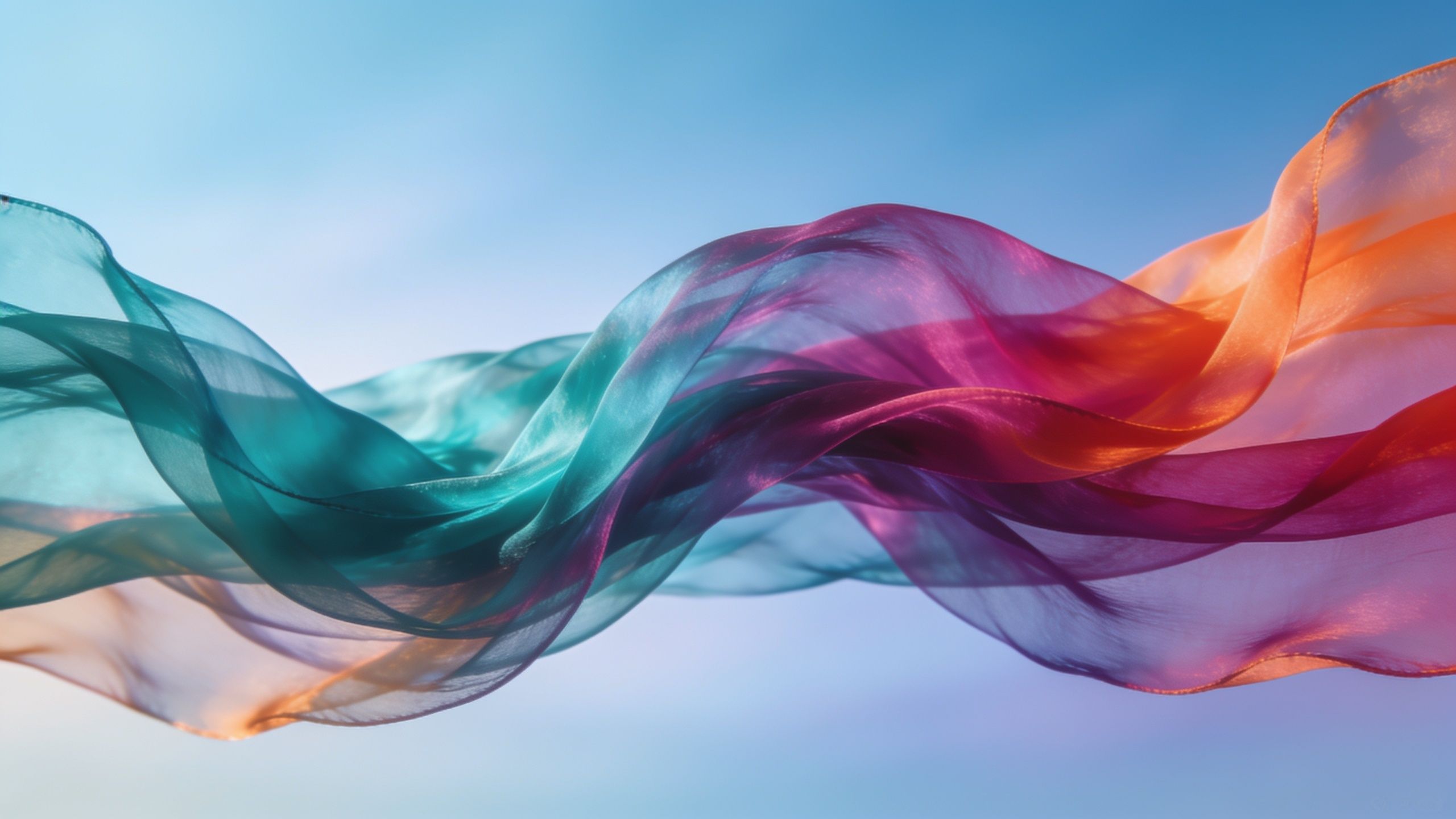 Colorful, translucent silk waves in shades of teal, pink, and orange float gracefully against a serene blue sky, creating a tranquil and uplifting mood.