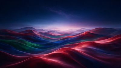Soft, velvet-textured dunes ripple across the scene in rich bands of red, blue, green, and purple, glowing as if lit from within beneath a deep indigo twilight sky. The surreal landscape feels tranquil and dreamlike, evoking a sense of otherworldly calm.