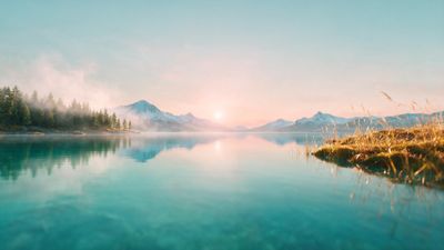 A soft golden sunrise bathes a glassy alpine lake in peach and turquoise tones, with misty pine forests on the left and snow-capped peaks reflecting on the still water to create a serene, uplifting mood.