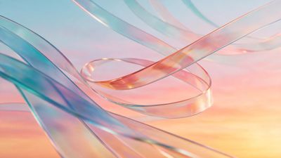 Iridescent translucent ribbons swirl across a pastel sky that fades from soft pink to pale blue, evoking a serene sunrise. The gentle colors and fluid shapes create a calm, dreamy mood.