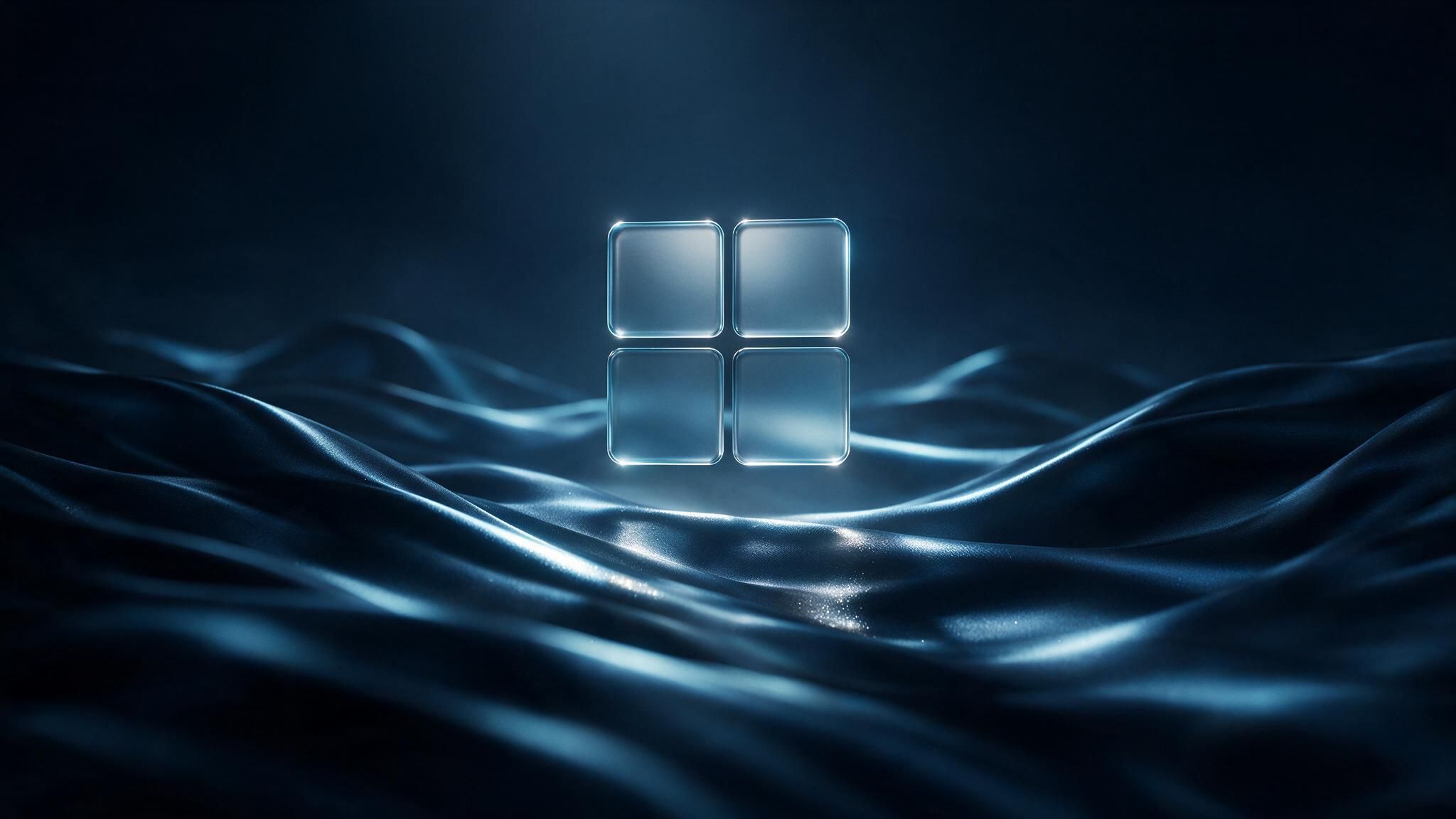 A transparent glass Windows logo hovers above softly lit, dark blue waves that resemble flowing fabric, creating a calm, futuristic atmosphere.