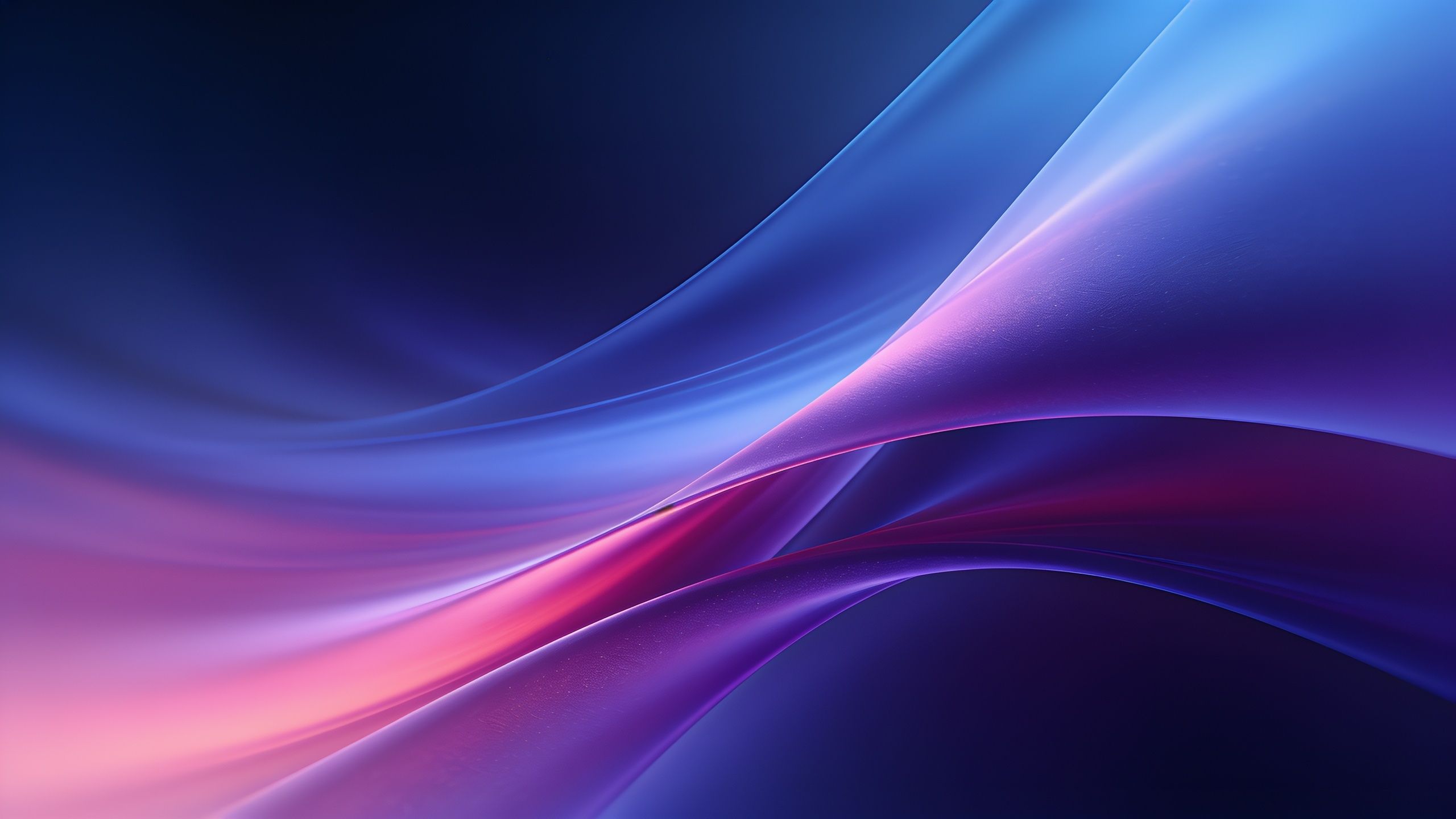 A vibrant 4K wallpaper featuring smooth, flowing waves in shades of blue and pink, creating an abstract and calming visual effect. The interplay of colors and curves evokes a sense of fluidity and tranquility.