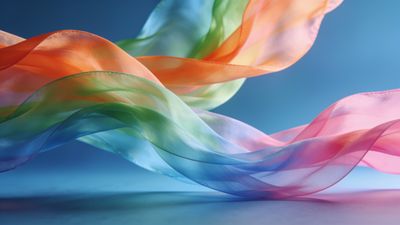 Colorful silk ribbons gracefully flow and intertwine against a soft blue background, creating a vibrant and dynamic visual that evokes a sense of movement and elegance.