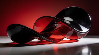 A sleek, abstract sculpture with intertwined red and black loops is set against a softly glowing red background, creating a modern and dynamic mood.