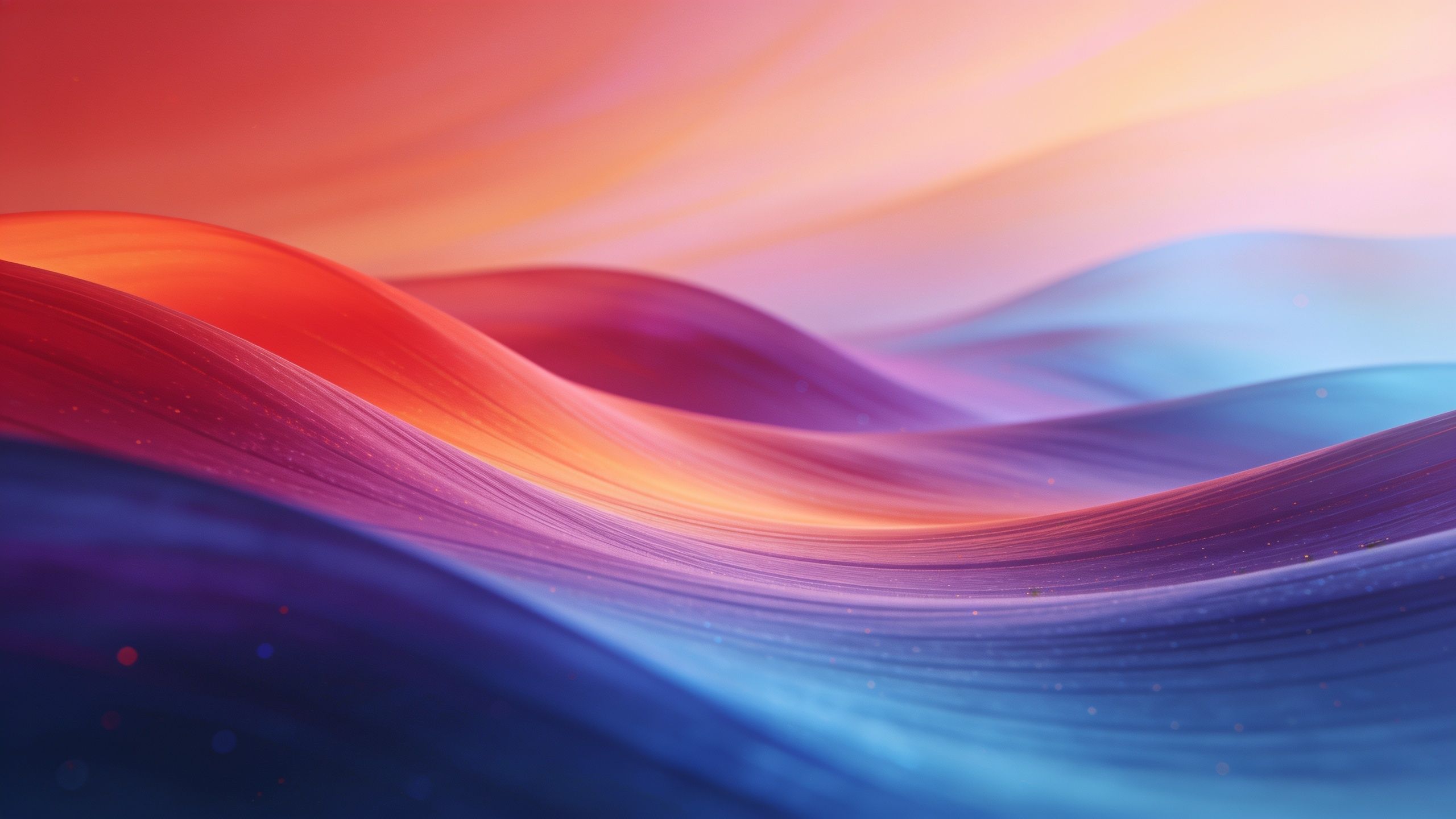 A vibrant abstract wallpaper featuring flowing waves of rich colors such as red, orange, purple, and blue, creating a dynamic and energetic mood. The smooth curves and gradients give a sense of movement and depth, enhancing the visual experience in 4K resolution.