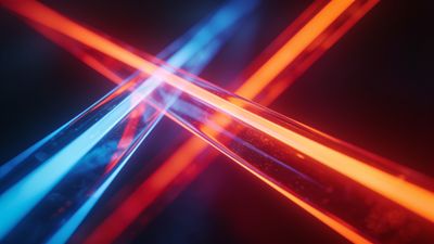 The image features intersecting beams of vibrant neon light in blue and red hues against a dark background, creating a dynamic and futuristic atmosphere. The bright, glowing lines form an abstract pattern, evoking a sense of energy and movement.