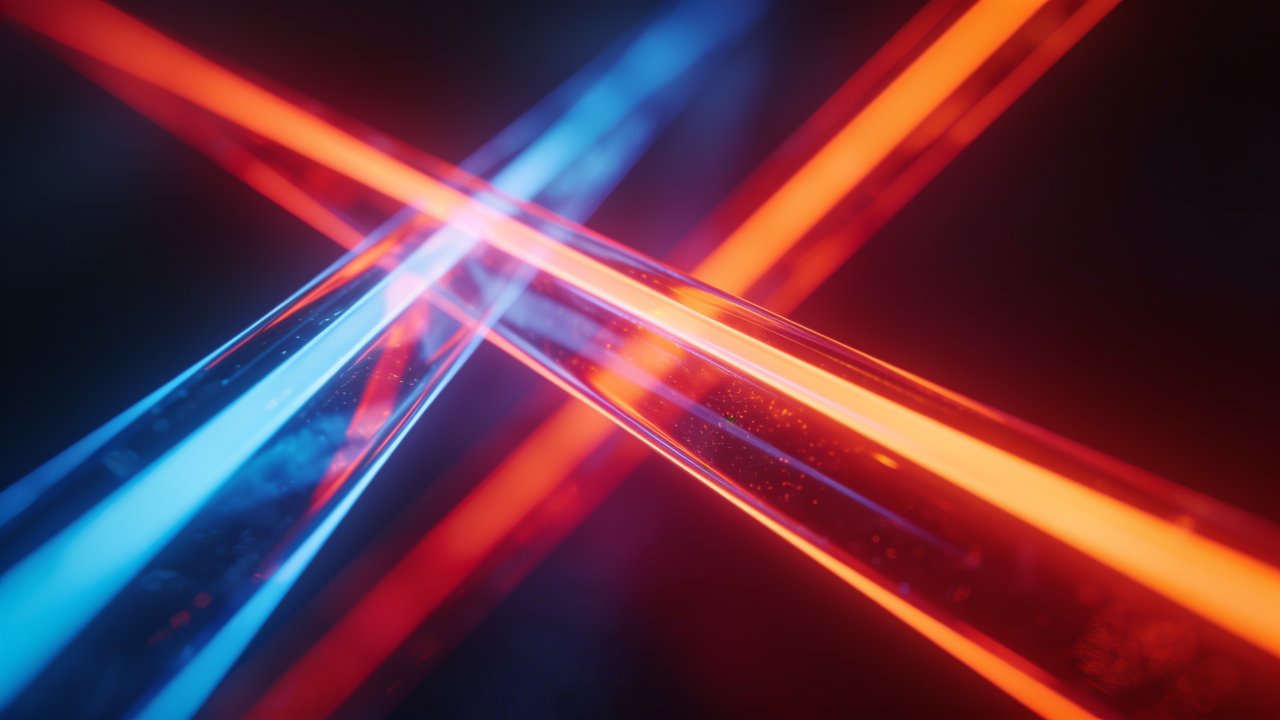 The image features intersecting beams of vibrant neon light in blue and red hues against a dark background, creating a dynamic and futuristic atmosphere. The bright, glowing lines form an abstract pattern, evoking a sense of energy and movement.