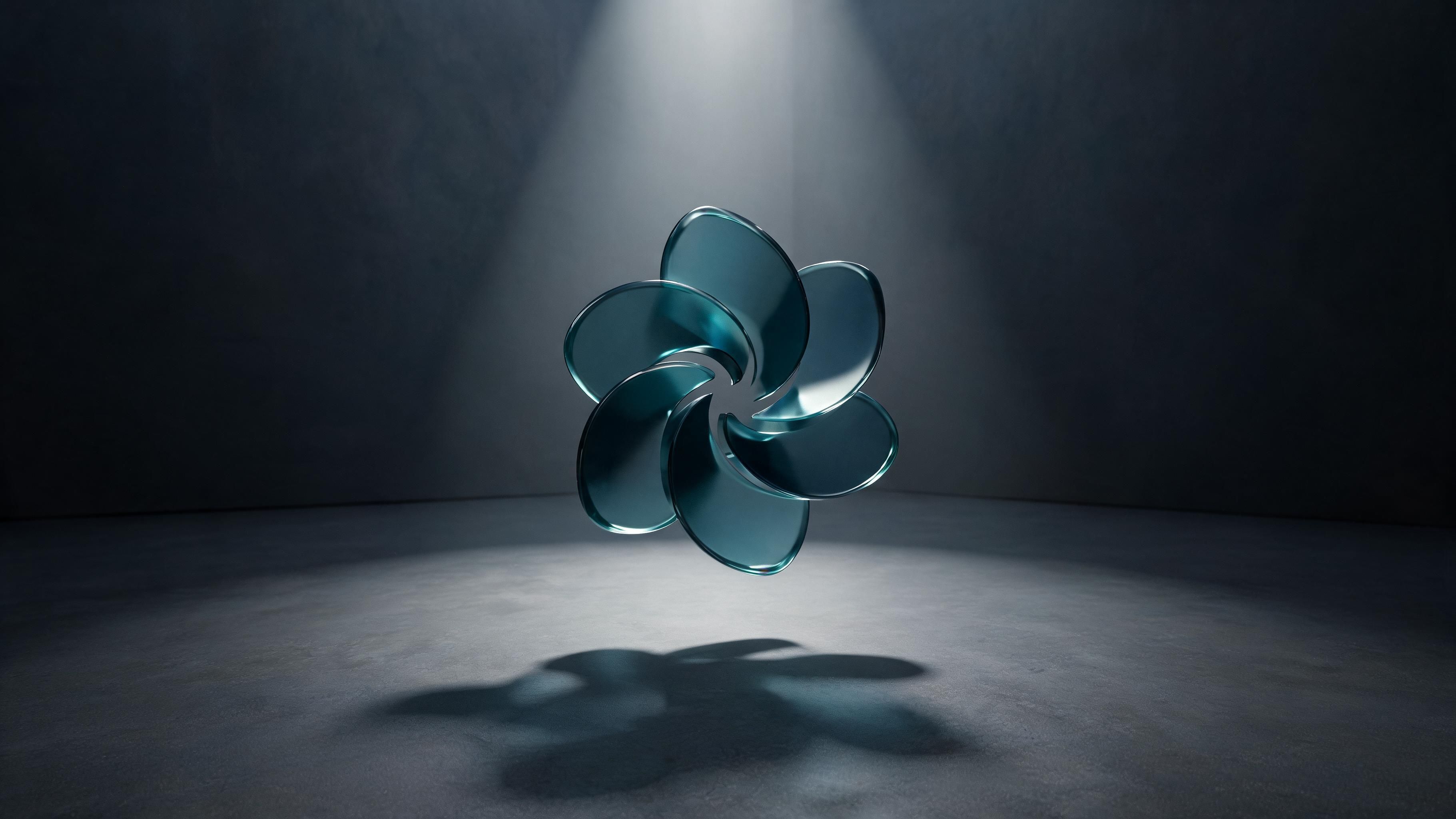 A teal, translucent glass sculpture shaped like a six-petaled abstract flower floats mid-air under a focused overhead spotlight in a dark, minimalist studio, its soft shadow stretching across the concrete floor. The dramatic lighting and smooth curves evoke a calm, futuristic mood.