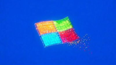 A wavy, flag-shaped grid of glossy orange, green, cyan, and red squares floats against a vivid royal-blue background, evoking a burst of digital energy. Tiny multicoloured pixels trail from its lower edge, giving the scene a playful, dynamic mood.